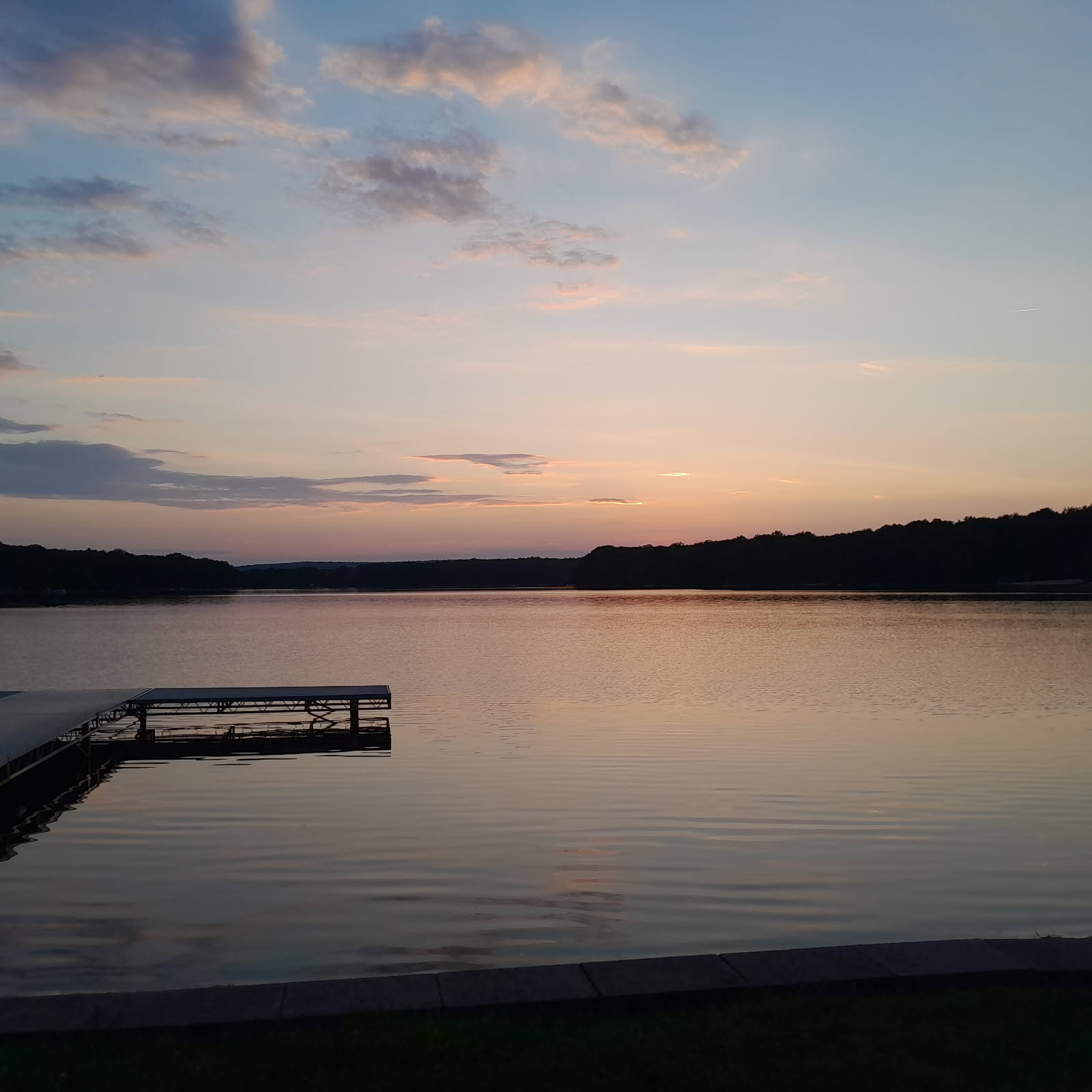A peaceful sunset over a calm ocean horizon